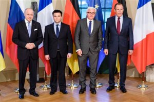 French Foreign Minister Laurent Fabius, Ukrainian Foreign Minister Pavlo Klimkin, German Foreign Minister Frank-Walter Steinmeier and Russian Foreign Minister Sergey Lavrov, from left, pose for a group photo at Villa Borsig, the official guest house of the foreign ministry, in Berlin on Monday, April 13, 2015 before their meeting to discuss implementation of the peace agreement brokered in Minsk, Belarus in February.  (Clemens Bilan/Pool Photo via AP)