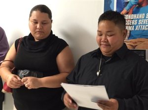 Loretta M. Pangelinan, 28, holds the application for a marriage license that she and her fiancee, Kathleen M. Aguero, 28, will turn in at the Office of Vital Statistics in the Guam Department of Public Health and Social Services on Wedneday, April 8, 2015.  Pangelinan and Aguero's application was refused by the clerk at the department's Office of Vital Statistics. Under Guam law, a marriage license is only issued to a couple of the opposite sex, department director James Gillan said. R. Todd Thompson, an attorney for Pangelinan and Aguero, said the couple plans to take their case to federal court.  (AP Photo/Grace O. Garces Bordallo)
