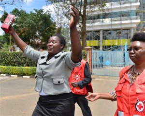 A woman gestures after she viewed the body of a relative killed in Thursday's attack on a university, at Chiromo funeral home, Nairobi, Kenya, Friday, April 3, 2015. Al-Shabab gunmen rampaged through a university in northeastern Kenya at dawn Thursday, killing scores of people in the group's deadliest attack in the East African country. Four militants were slain by security forces to end the siege just after dusk. (AP Photo)