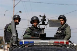 Members of the Jordanian government forces patrol the border with Syria near the Nasib crossing in the town of Jaber, north of Mafraq, Jordan, Thursday, April 2, 2015. Syrian rebels and fighters from the al-Qaida-affiliated Nusra Front have captured the only functioning border crossing with Jordan and three nearby military posts, prompting Syrian government bombing raids on the area, activists said Thursday. The Jordanian government closed the Nasib crossing Tuesday night for security reasons. (AP Photo/Raad Adayleh)