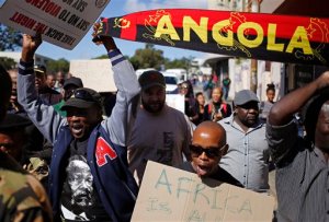 People march against immigrant attacks in South Africa, in Cape Town, South Africa, Wednesday, April 22, 2015. Police officers and soldiers raided a hostel considered a hotspot for anti-immigrant attacks in downtown Johannesburg as South Africa continued a crackdown in xenophobic violence. (AP Photo/Schalk van Zuydam)