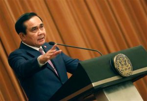 Thailand's Prime Minister Prayuth Chan-ocha delivers a speech at Government House in Bangkok, Thailand, Friday, April 3, 2015. The United Nations joined international rights groups Thursday in criticizing a decision by Thailand's military government to invoke a law that gives the junta chief near-absolute authority without any accountability. Prime Minister Prayuth on Wednesday lifted martial law, which he imposed shortly before taking power in a coup last year, and instead invoked Article 44 of a junta-imposed interim constitution, which allows him to take any measures to promote public order and unity.  (AP Photo/Sakchai Lalit)