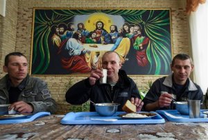 In this photo taken on Thursday, March 26, 2015 prisoners of Zhdanivskaya prison are having lunch in the village of Zhdanivka, eastern Ukraine. Medical supplies have been in short supply, threatening the lives of nearly 400 prisoners who need treatment. The principal scourge: Tuberculosis. The disease spreads prodigiously in jails and develops into hard-to-treat forms unless properly addressed. "TB is so common within the penitentiary system that many inmates dont see it as a deadly disease _ they see catching TB as a normal part of life in prison," Doctors Without Borders said in a recent situation report. "Some even tell us they dont care if they die or not." (AP Photo/Mstyslav Chernov)