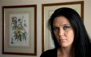 Sarah Dieffenbacher, poses for a picture in Washington, Monday, March 30, 2015. Former and current college students calling themselves the “Corinthian 100” say they are on a debt strike and refuse to pay back their student loans. The name comes from Corinthian Colleges Inc., which operated the for-profit Everest College, Heald College and WyoTech schools before agreeing last summer to sell or close its 100-plus campuses. Dieffenbacher, who works in collections for a property management company, said she was allowed at first to defer her loan payments, but now should be paying about $1,500 a month that she can’t afford. (AP Photo/Manuel Balce Ceneta)