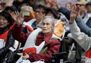 Sumiteru Taniguchi, a survivor of the nuclear bombing at Nagasaki, Japan, participates in an anti-nuclear rally in Union Square in New York, Sunday, April 26, 2015. This year marks the 70th anniversary of the United States using nuclear bombs on Hiroshima and Nagasaki in Japan. (AP Photo/Seth Wenig)