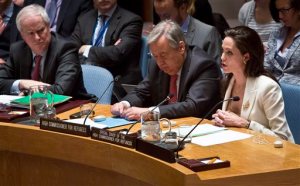 U.N. High Commissioner for Refugees António Guterres, center, and British U.N. ambassador Mark Grant, left, listens as U.N. Special Envoy for Refugees Angelina Jolie , right, brief the U.N. Security Council on Syria's refugee crisis, Friday, April 24, 2015. (AP Photo/Bebeto Matthews)