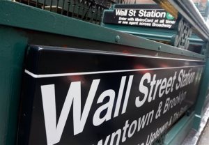FILE-This Oct. 29, 2014 file photo shows the Wall Street subway stop on Broadway, in New York's Financial District. U.S. stocks are falling broadly in early trading on Friday, April 17, 2015, following steep declines in Europe and some results from big U.S. companies. Nine of the 10 industry groups of the Standard and Poor’s 500 are down, led by information technology companies. (AP Photo/Richard Drew)