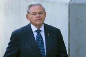 U.S. Sen. Bob Menendez arrives at Newark federal court, Thursday, April 2, 2015, in Newark, N.J. Menendez, the top Democrat on the U.S. Senate Foreign Relations Committee, was indicted Wednesday on corruption charges. A federal grand jury indictment accuses Menendez of using the power of his Senate seat to benefit Salomon Melgen, a wealthy Florida eye doctor who prosecutors say provided the senator with luxury vacations, airline travel, golf trips and tens of thousands of dollars in contributions to a legal defense fund. (AP Photo/John Minchillo)