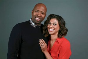 Former NBA player Kenny Smith and his wife Gwendolyn Osborne-Smith pose for a portrait to promote their TBS network reality series "Kenny Smith and Family" on Wednesday, April 1, 2015, in New York. (Photo by Amy Sussman/Invision/AP)