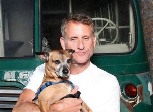 In this undated photo provided by Steve Gilberg, Gilberg and his dog Joey pose for photos in Chicago. The 6-year-old pug-Chihuahua mix came down with canine flu. "It was a Sunday morning and he just started coughing really, really hard, kind of like a smoker's hacking cough, coming from the belly," said Gilberg. (Steve Gilberg via AP)