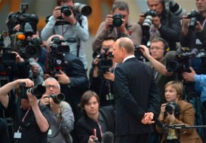 Russian President Vladimir Putin speaks to the media after his live televised call-in show with the nation in Moscow, Russia, Thursday, April 16, 2015. President Putin received more than 3 million questions before and during the carefully orchestrated show, which involved live hookups with Russias regions as well as a studio audience. (Alexei Druzhinin, RIA-Novosti, Presidential Press Service via AP)