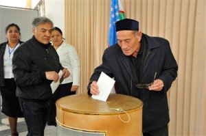 An Uzbek man casts his ballot at a polling station in Tashkent, Uzbekistan, Sunday, March 29, 2015. Islam Karimov, 77, has led the double-landlocked former Soviet republic of 30 million people uninterruptedly since the late 1980s, and ruthlessly quashed all opposition to his rule. Uzbekistan's election commission says more than 70 percent of eligible voters have already cast their ballots midway through an election certain to be won by longtime leader Islam Karimov. (AP Photo)