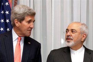 FILE - In this March 16, 2015 file photo U.S. Secretary of State John Kerry, left, listens to Iran's Foreign Minister Mohammad Javad Zarif, right, before resuming talks over Iran's nuclear program in Lausanne, Switzerland. The State Department said Kerry and Iran's Foreign Minister Mohammad Javad Zarif would meet Monday, April 27, 2015 at the United Nations on the sidelines of a conference on the nuclear non-proliferation treaty in which both men are participating.  (AP Photo/Brian Snyder, Pool, File)
