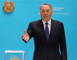 Kazakhstan's President and the main presidential candidate Nursultan Nazarbayev speaks to journalists after voting at a poling station in Astana, the capital of Kazakhstan, Sunday, April 26, 2015. Voters in Kazakhstan turned out in abundance at polling stations Sunday for a presidential election guaranteed to overwhelmingly reconfirm the 74-year-old incumbent, who has ruled over the former Soviet republic for more than 25 years. (AP Photo/Alexei Filippov)