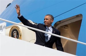 President Barack Obama waves as he boards Air Force One, Thursday, April 2, 2015, at Andrews Air Force Base, Md., en route to Louisville, Ky., where he will tour and speak at Indatus, a Louisville-based technology company that specializes in cloud-based products and services. The president is finally heading to Kentucky after delaying his departure by several hours after the breakthrough in the Iran nuclear talks. (AP Photo/Carolyn Kaster)
