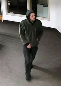 This undated image from a surveillance video released by the Fairbanks, Alaska, Police Department shows Roland Huntington Grace. Crocs plastic shoes left tread marks that helped link Grace to downtown burglaries, authorities said. (Fairbanks Police Department via AP)