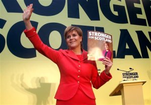 Scottish National Party leader Nicola Sturgeon holds a copy of the party's manifesto during its launch in Edinburgh, Scotland, Monday April 20, 2015. Britain will vote in a general election on May 7. (Danny Lawson/PA via AP) UNITED KINGDOM OUT  NO SALES  NO ARCHIVE  MANDATORY CREDIT