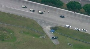 This aerial image taken from a video provided by WFTV shows the scene after a deadly crash at the Exotic Driving Experience at Walt Disney World, Sunday, April 12, 2015, in Orlando, Fla. A Lamborghini that was part of an exotic car racing attraction at Walt Disney World crashed into a guardrail, killing a passenger and injuring the driver on Sunday, police said. (WFTV via AP) 