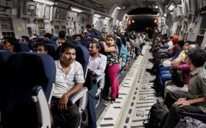 Indians evacuated from Yemen sit inside the Indian Air Force C17 Globemaster aircraft upon their arrival at Chhatrapati Shivaji International Airport in Mumbai, India, Thursday, April 2, 2015. India is evacuating its citizens from Yemen amid the growing violence in the Middle Eastern country. (AP Photo/Press Trust of India, Mitesh Bhuvad)