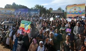 Thousands of people attend a government-supported gathering to protest the recent killing of many Ethiopian Christians in Libya by the Islamic State extremist group, at Meskel Square in Addis Ababa, Ethiopia Wednesday, April 22, 2015. Some stone-throwing protesters clashed with police and directed their anger at Ethiopia's government, seen by some as not doing enough to raise the living standards of the most vulnerable people, while others raised slogans including one that said "We want revenge for our sons' blood," referring to Ethiopians seen being beheaded or shot in a video released by the Islamic extremist group Islamic State. (AP Photo)