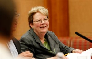 UVa president Teresa Sullivan listens as board members speak about her job performance during the University of Virginia Board of Visitors meeting Tuesday, May 19, 2015 on campus at the Special Collection Library in Charlottesville, Va. The Board of Visitors voted to extend President Sullivan's contract and increase her salary. (Andrew Shurtleff/The Daily Progress via AP)