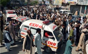 People escort ambulances carrying the bodies of passengers who were killed by gunmen when they hijacked two buses, during a protest march in Quetta, Pakistan. Saturday, May 30, 2015.  Hundreds of Pakistani Pashtuns protested Saturday after deadly bus hijackings that killed 19 people, saying they refused to bury their dead until the government guaranteed their protection. (AP Photo/Arshad Butt)