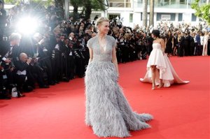FILE - In this Wednesday, May 13, 2015 file photo, actress Naomi Watts, center, poses for photographers as she arrives for the opening ceremony and the screening of the film La Tete Haute (Standing Tall) at the 68th international film festival, Cannes, southern France. (AP Photo/Lionel Cironneau, File)