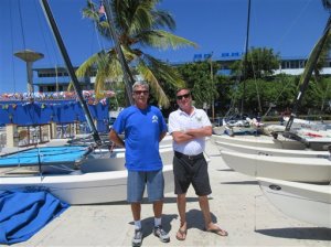 In this May 18, 2015 photo, George Bellenger, left, and Joe Weatherby, organizers of the first official boat race from Key West to Havana in more than 50 years, pose for a photo at the Hemingway Marina in Havana. Our working mantra is Bridging cultural divides through traditional maritime heritage, said Bellenger. The race had to be postponed from April to May because it took so long to all the paperwork required by the U.S. government approved. Their group of 115 people and nearly 20 vessels is among an increasing number of Americans to visit Havana since President Barack Obama announced a thaw in U.S.-Cuba relations. (AP Photo/Beth J. Harpaz)