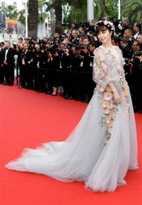 Actress Fan Bing Bing poses for photographers as she arrives for the screening of the film Mad Max: Fury Road at the 68th international film festival, Cannes, southern France, Thursday, May 14, 2015. (AP Photo/Lionel Cironneau)