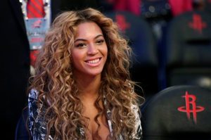 FILE - In this Sunday, Feb. 17, 2013 file photo, Beyonce sits courtside before the NBA All-Star basketball game in Houston. Music superstar Beyonce has visited Haiti with a United Nations official for humanitarian affairs. Haiti U.N. mission spokeswoman Sophie Boutaud de la Combe said Saturday, May 16, 2015 that Beyonce visited the Caribbean country to look at progress made since a devastating earthquake in January 2010 and to "meet some of the people who were affected by it." (AP Photo/Eric Gay, File)