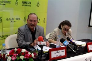 Amnesty International director Mohammed Sektaoui, left, addresses reporters at a press conference next to Amnesty researcher Sirine Rached, in Rabat, Morocco, Tuesday, May 19, 2015. Human rights group Amnesty International has issued a report documenting widespread torture by the Moroccan state, contrary to its public commitment to reform. The report recommended that lawyers be present during interrogations, allegations of torture be investigated and those reporting abuses be protected -- all measures present in the penal code but rarely implemented. (AP Photo/Paul Schemm)