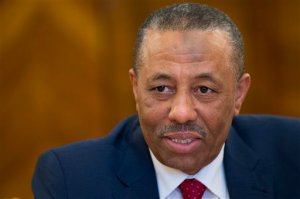 FILE - In this Wednesday, April 15, 2015 file photo, Libyan Prime Minister Abdullah al-Thinni speaks to Russian Foreign Minister Sergey Lavrov during their meeting in Moscow, Russia. A spokesman for Libya's internationally recognized government said Tuesday, May 26, 2015, that gunmen tried to assassinate al-Thinni on his way to the airport in the eastern city of Tobruk, Libya. (AP Photo/Alexander Zemlianichenko, File)