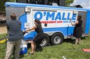 Workers remove a campaign sign from a truck after an event with former Maryland Gov. Martin O'Malley to announce that he is entering the Democratic presidential race, on Saturday, May 30, 2015, in Baltimore. O'Malley on Saturday joined the Democratic presidential race with a longshot challenge to Hillary Rodham Clinton for the 2016 nomination. (AP Photo/Evan Vucci)