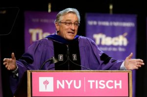 Actor Robert De Niro addresses the class of 2015, faculty, and guests during  New York University's Tisch School of the Arts commencement  ceremony,  Friday, May 22, 2015, in New York. De Niro, who quit high school to pursue an acting career, was the honored speaker at the raucous ceremony for 1,200 graduates at The Theater at Madison Square Garden. (AP Photo/Mary Altaffer)