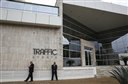 Private security guards stand outside the headquarters of sports marketing company Traffic Sports, in Sao Paulo, Brazil, Thursday, May 28, 2015. U.S. officials say Jose Hawilla, the owner of the Brazil-based sports marketing firm, is one of four men who has pleaded guilty in the U.S. soccer corruption investigation involving bribes totaling more than $100 million. (AP Photo/Andre Penner)