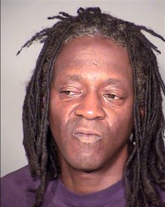 This undated booking photo provided by the Clark County Detention Center shows William Drayton Jr. aka Flavor Flav after his arrest in Las Vegas. Authorities say they arrested the entertainer shortly after midnight on Thursday, May 21, 2015, in Las Vegas for driving under the influence, speeding, possessing less than an ounce of marijuana and having an open container of alcohol in the 2005 black BMW he was driving. (Clark County Detention Center via AP)