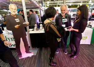 FILE - In this Feb. 19, 2015 file photo, comedian and marijuana icon Tommy Chong, second from right, talks to visitors as he stands near a life-sized cardboard cut-out of himself, while promoting his line of marijuana products, including his "Chongwater" hemp drink, a custom joint roller, and his "Smoke Swipe" wipes that can remove the odor of pot smoke from clothing, during CannaCon, a marijuana business trade show in Seattle. On Monday, April 20, 2015, singer Willie Nelson joined the list of Chong and other celebrities promoting pot-related products, saying he plans to roll out his own brand of marijuana called ``Willies Reserve. (AP Photo/Ted S. Warren, file)