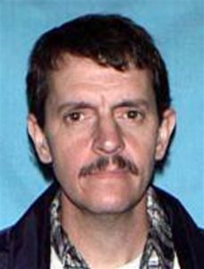 FILE - This file photo provided by the Missouri State Highway Patrol shows James Barton Horn Jr., of Sedalia, Mo. Police are searching for Horn after finding Sandra Kay Sutton, 46, and her son, Zachary Wade Sutton shot to death Thursday, May 21, 2015, at a relatives home in Clinton, Mo. Authorities say Sutton's former boyfriend, 47-year-old Horn, was charged earlier this month with kidnapping, armed criminal action and unlawful use of a weapon for allegedly keeping Sutton in a wooden box for four months. He was freed about three weeks ago. (Missouri State Highway Patrol via AP, File)