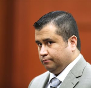 FILE - In this July 9, 2013 file photo, George Zimmerman leaves the courtroom for a lunch break his trial in Seminole Circuit Court, in Sanford, Fla. A police report says a man charged with shooting at George Zimmerman on May 11, 2015, had a fixation on the former neighborhood watch leader. The report made public Tuesday, May 19, 2015,  says 36-year-old Matthew Apperson had recently been admitted to a mental institution and had shown signs of paranoia, anxiety and bipolar disorder. (AP Photo/Orlando Sentinel, Joe Burbank, Pool, File via AP)