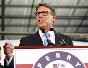 Former Texas Gov. Rick Perry speaks to supporters to announced the launch of his presidential campaign for the 2016 elections, Thursday, June 4, 2015, in Addison, Texas. (AP Photo/Tim Sharp)