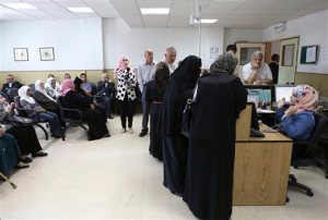In this Sunday, June 14, 2015, photo, patients wait for their checkups at Jordan's National Center for Diabetes in Amman, Jordan. The center is particularly busy ahead of the Muslim holy month of Ramadan when diabetics seek advice on whether they can observe the sunrise-to-sundown Ramadan fast. Islam exempts the sick from fasting and doctors say many diabetics should not be fasting, but tens of millions of diabetic Muslims struggle each year with the stressful choice between faith and health. (AP Photo/Khaled Al Odat)