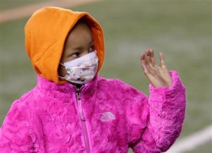 FILE - In this Nov. 6, 2014 file photo, Leah Still waves during a ceremony in the first half of an NFL football game between the Cincinnati Bengals and the Cleveland Browns in Cincinnati.  Bengals defensive tackle Devon Still is asking for prayers for his daughter, Leah, who's had a setback in her fight against cancer. The 5-year-old girl went into a hospital on May 5, 2015 to start the process of getting a stem cell transplant. The 4-to-6-week process involves high doses of chemotherapy at the outset. (AP Photo/AJ Mast)