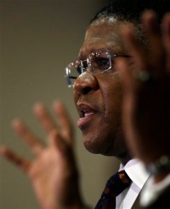 South Africa's sports minister Fikile Mbalula gestures as he speaks during a news conference in Johannesburg, South Africa, Wednesday, June 3, 2015.  Mbalula "categorically" denied on Wednesday that the $10 million paid to former FIFA official Jack Warner in 2008 was a bribe for his help in securing the World Cup. (AP Photo/Themba Hadebe)