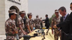 Members of the Jordanian border guard, left, stand behind a table where various devices for first detection of possible chemical or biological weapons materials are displayed for visitors at their headquarters near the city of Zarqa, Jordan on Monday, June 8, 2015. The devices are part of a partially U.S.-funded program to improve Jordans surveillance of its borders with Syria and Iraq and to prevent infiltration of militants, including from the extremist group Islamic State, as well as the possible influx of weapons. (AP Photos/Karin Laub)