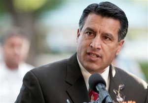 FILE - In this Sept. 25, 2011, file photo Nevada Gov. Brian Sandoval speaks during a memorial service in Reno, Nev. Sandoval announced Tuesday, June 9, 2015 that he will not run for the U.S. Senate seat being vacated by longtime Democratic Sen. Harry Reid. (AP Photo/Kevin Clifford, File)
