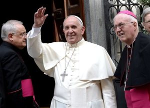 FILE - In this June 21, 2015 file photo, Pope Francis salutes the faithful gathered outside the hospital Cottolengo of Turin, northern Italy. Italian tenor Andrea Bocelli, Colombian pop singer Juanes and the Philadelphia Orchestra are among the musical acts organizers say will perform for Pope Francis during his visits to the city this fall. World Meeting of Families organizers say Tuesday the singers and symphony orchestra will appear at the Festival of Families celebration Sept. 26 on the Benjamin Franklin Parkway in downtown Philadelphia. (AP Photo/Massimo Pinca, File)