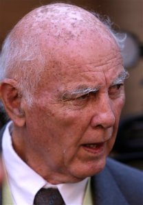Retired tennis player Bob Hewitt looks on after his leave to appeal sentence was granted, at the high court in Pretoria, South Africa, Friday, June 19, 2015. A judge in South Africa will allow Grand Slam tennis champion Bob Hewitt to appeal his jail sentence after he was convicted of rape and sexual assault, extending his bail pending a higher courts decision.  Judge Bert Bam ruled on Friday that he would not, however, allow 75-year-old Hewitt to appeal his guilty conviction. (AP Photo/Themba Hadebe)