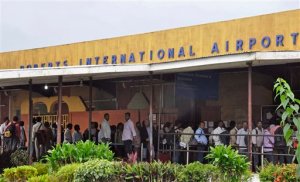 FILE In this file photo taken on Sunday, Aug. 24, 2014. people stand inline, at the Roberts International Airport as they leave Liberia, with fear of the Ebola virus spreading in the city of Monrovia, Liberia. The World Health Organization declared Liberia Ebola-free in early May. Still, fear of the deadly disease still reigns in many places, causing students to miss out on scholarships abroad, and keeping relatives from attending weddings and funerals. (AP Photo/Abbas Dulleh, File)