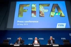 FIFA President Sepp  Blatter, center, speaks next to Jerome Valcke, FIFA Secretary General, left, and Walter De Gregorio, Director Communications and Public Affairs, right, during a news  conference following the FIFA Executive Committee meeting in Zurich, Switzerland, on Saturday, May 30, 2015. (Ennio Leanza/Keystone via AP)
