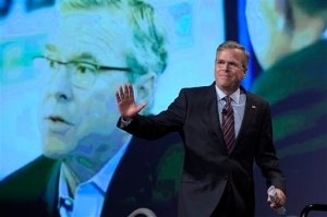 Former Florida Gov. Jeb Bush waves while walking on the stage to speak at Rick Scott's Economic Growth Summit in Lake Buena Vista, Fla., Tuesday, June 2, 2015. (AP Photo/Phelan M. Ebenhack)